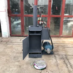 Professional paint bucket flattening machine. Small, vertical, fully steel-framed hydraulic baling machine