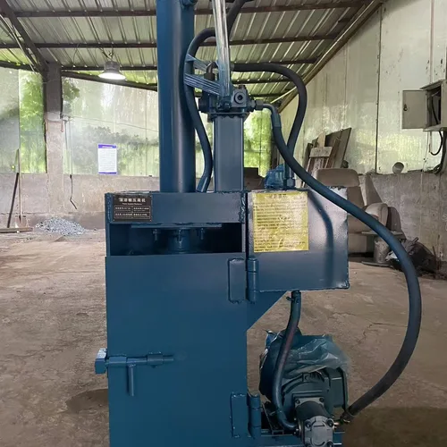 Professional paint bucket flattening machine. Small, vertical, fully steel-framed hydraulic baling machine