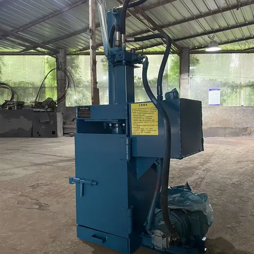 Professional paint bucket flattening machine. Small, vertical, fully steel-framed hydraulic baling machine