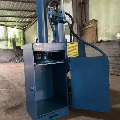 Professional paint bucket flattening machine. Small, vertical, fully steel-framed hydraulic baling machine