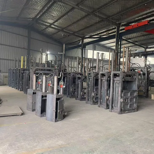 Professional paint bucket flattening machine. Small, vertical, fully steel-framed hydraulic baling machine