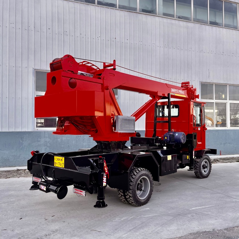 Four unlike a crane attached to a vehicle