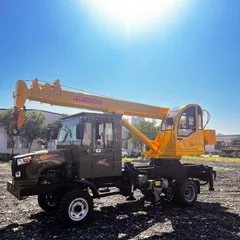 Four unlike a crane attached to a vehicle