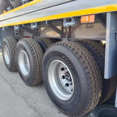 3 Axle Flatbed Semi Trailer For Heavy Cargo Transport