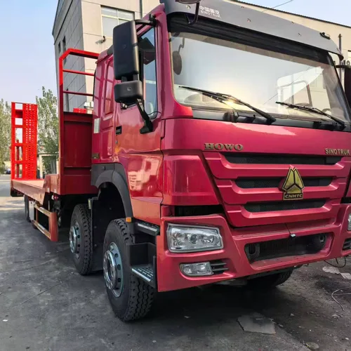 Brand New Sinotruk Howo 8×4 Flatbed Excavator Transport Truck, Spring Loaded Ramp, Mining Heavy Tires, Factory Stock for Africa Export