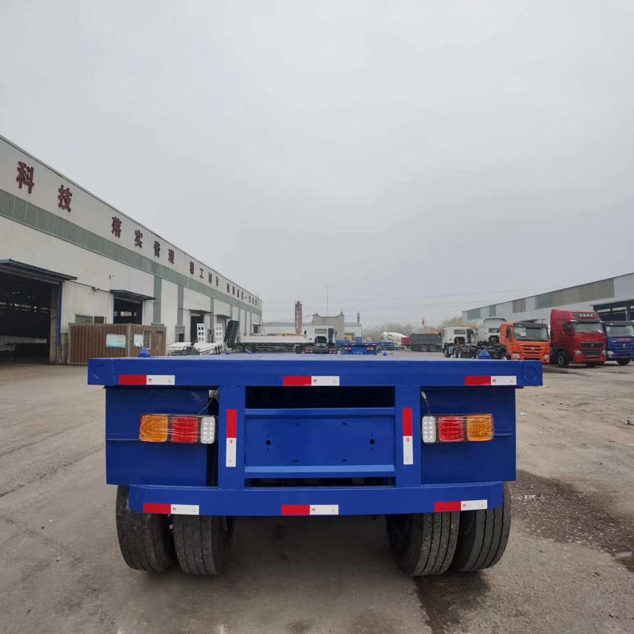 New Tri-Axle Flatbed Container Semi Trailer 20/40/45ft Q345 High Strength Steel Load 40-80 Ton