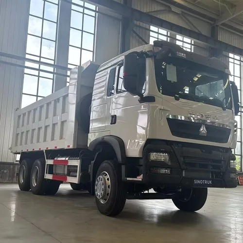 Drive Configuration: 6×4 (single front steering axle + double rear drive axles, 10 tires in total), the mainstream configuration for heavy-duty engineering vehicles Scenario: The vehicles in the picture are parked in a large heavy-duty truck warehouse pla