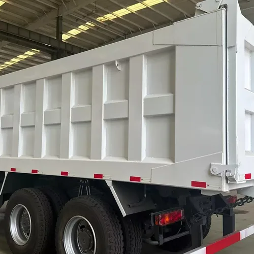 Drive Configuration: 6×4 (single front steering axle + double rear drive axles, 10 tires in total), the mainstream configuration for heavy-duty engineering vehicles Scenario: The vehicles in the picture are parked in a large heavy-duty truck warehouse pla