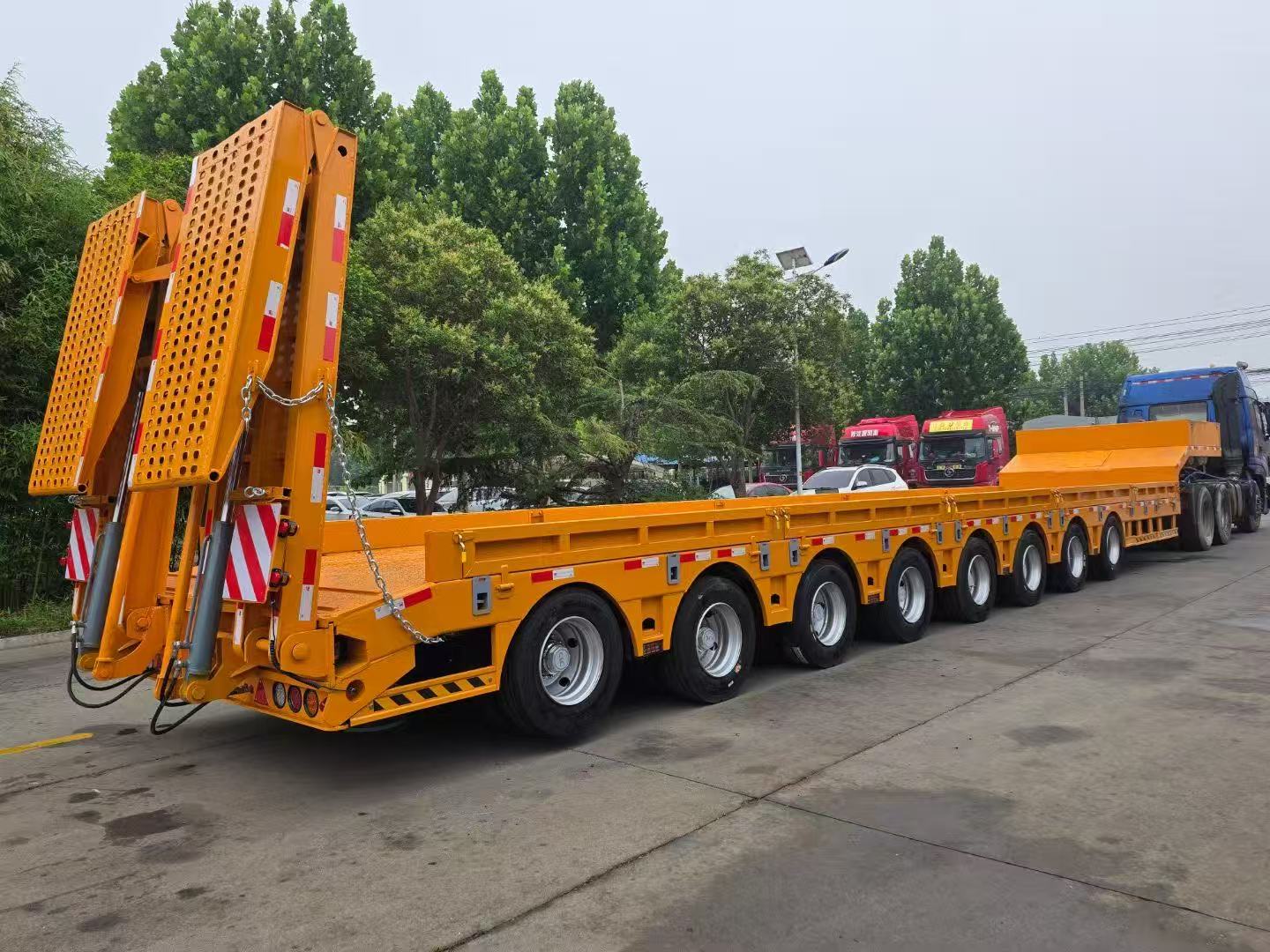Eight-axle Low-bed Heavy Transport Semi-trailer With Integrated Hydraulic Folding Loading Ramp Custom Wide Ultra-low Deck For Central Asia Excavator Mining Rig Haulage