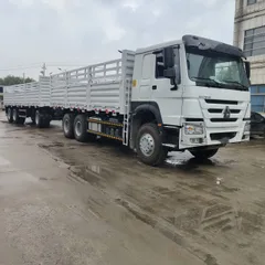 HOWO 6x4 Cargo Truck with Full Sidewall Stake Semi-trailer (One Tractor + One Stake Trailer Combination)