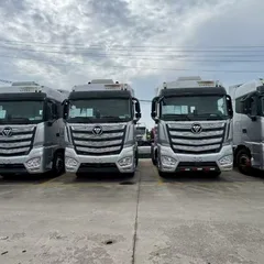 Factory Direct Used AUMAN EST Flat Floor Truck Tractor 580HP Double Layer Chassis Leaf Spring Suspension For Central Asia Southeast Asia Freight Bulk Shipment