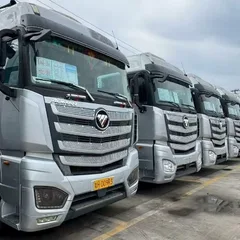 Factory Direct Used AUMAN EST Flat Floor Truck Tractor 580HP Double Layer Chassis Leaf Spring Suspension For Central Asia Southeast Asia Freight Bulk Shipment