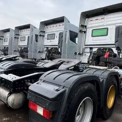 Factory Direct Used AUMAN EST Flat Floor Truck Tractor 580HP Double Layer Chassis Leaf Spring Suspension For Central Asia Southeast Asia Freight Bulk Shipment