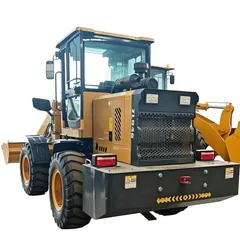 SHENTUI 946 compact wheel loader working in a narrow material yard